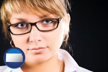 a young woman wearing eyeglasses - with Kansas icon